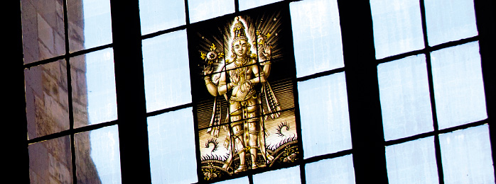 Stained glass window with an image of Vishnu.