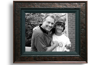 A picture frame with John and his son Will smiling together