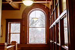 Light streams through a Palladian window on the second floor, one of many sources of natural light in a building designed to foster reading and study.